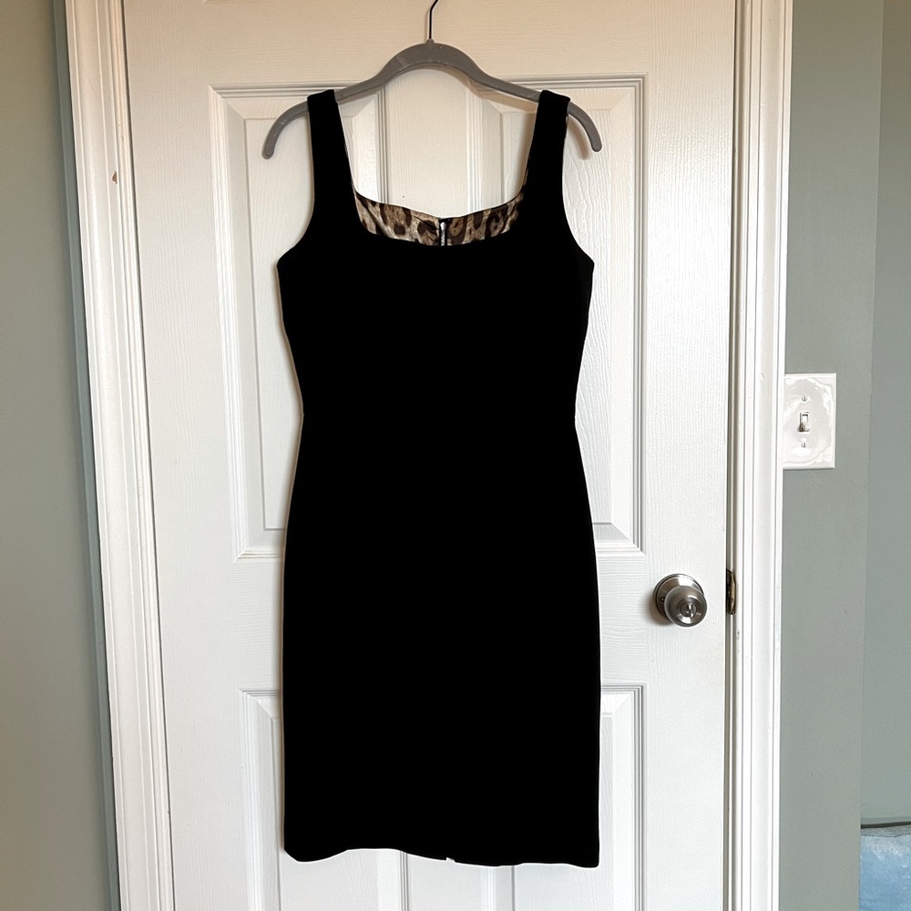 Dolce & Gabbana • knee-length black dress • cheetah print lining • back slit